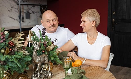 beautiful couple sitting in living room 