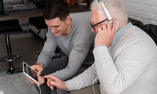 grand parent learning to use digital device