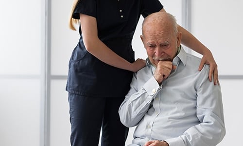 nurse taking care of old man
