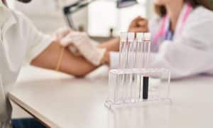 patient getting blood tested by the doctor 