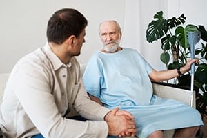 Parkinson's caregiver talking with a patient