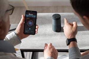 Parkinson’s patient learning to use a voice-controlled assistant at home.