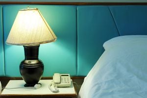 lamp and telephone beside the bed for helping patients with Parkinson’s.