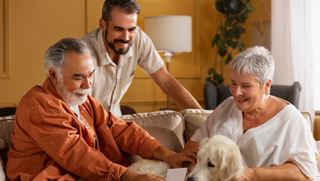 Person with Parkinson’s sitting with his family discussing what to expect after Parkinson’s diagnosis.