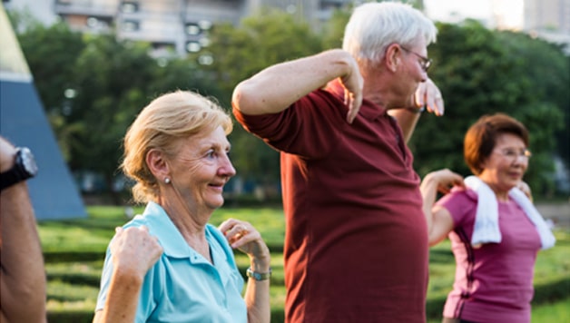 People with Parkinson’s doing light exercises to manage Parkinson’s disease.